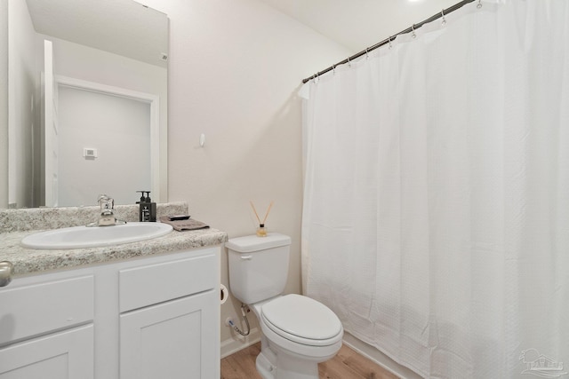 5252 Peach Dr, Pace, FL 32571 - full bathroom with wood finished floors, toilet, vanity, and a shower with curtain
