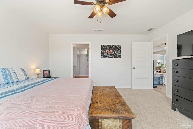 5252 Peach Dr, Pace, FL 32571 - bedroom featuring light carpet, baseboards, ceiling fan, and ensuite bath