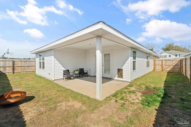 5252 Peach Dr, Pace, FL 32571 - rear view of property featuring a fire pit and a patio area