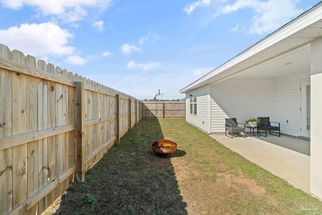 5252 Peach Dr, Pace, FL 32571 - fenced backyard with a fire pit and a patio