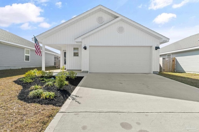 5252 Peach Dr, Pace, FL 32571 - view of front of property featuring concrete driveway and an attached garage