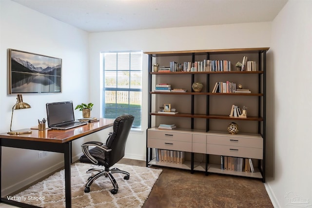 office space with baseboards