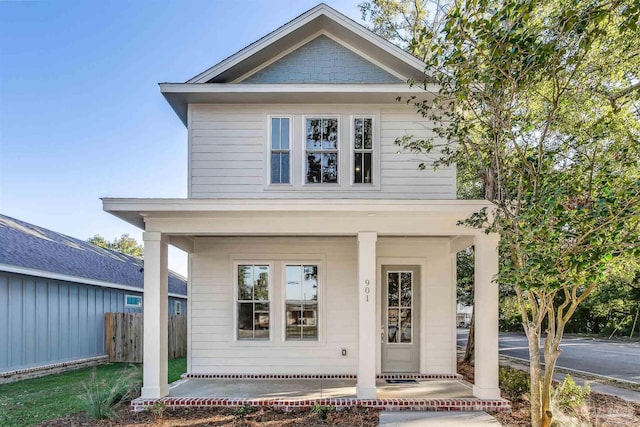 view of front of house featuring fence