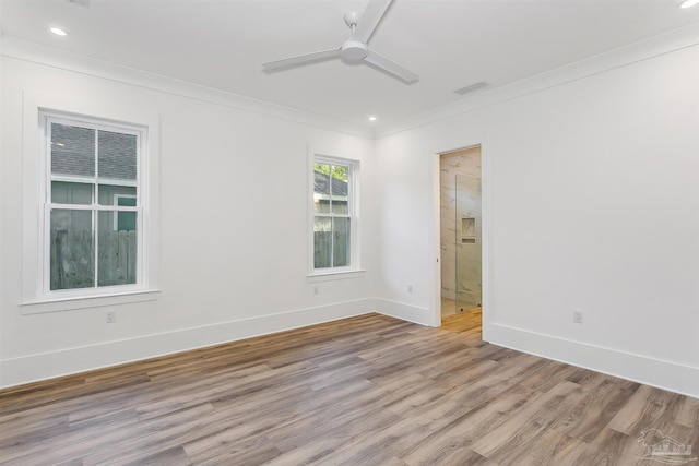 empty room with light wood-style flooring, recessed lighting, a ceiling fan, baseboards, and ornamental molding