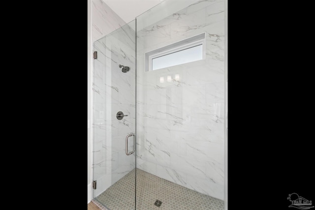 full bath featuring a shower stall