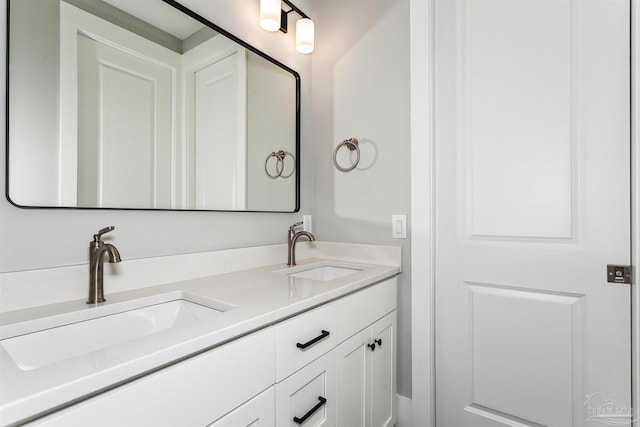 full bathroom featuring double vanity and a sink