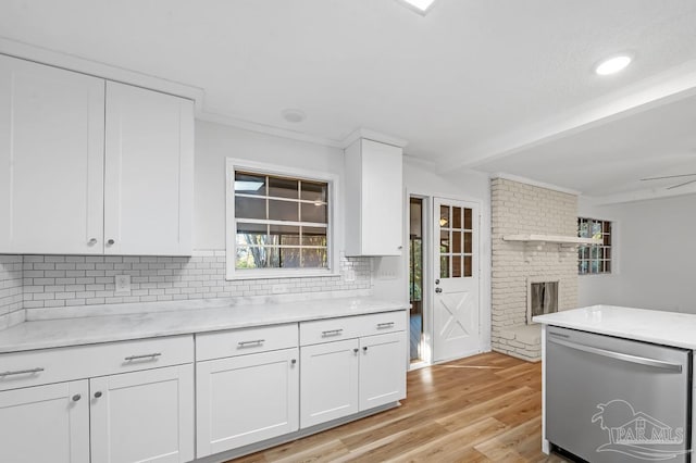 kitchen featuring light hardwood / wood-style floors, tasteful backsplash, dishwasher, white cabinets, and beam ceiling