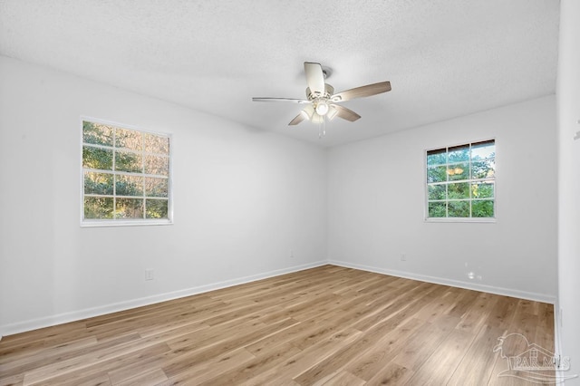 unfurnished room with light wood-type flooring, ceiling fan, and a textured ceiling