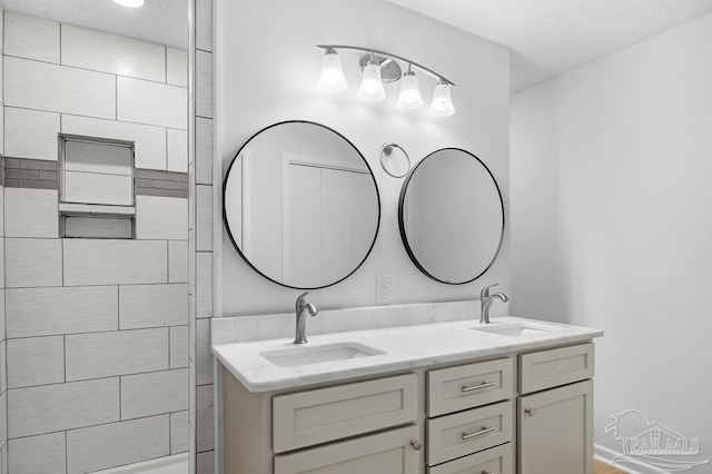 bathroom featuring vanity and a textured ceiling