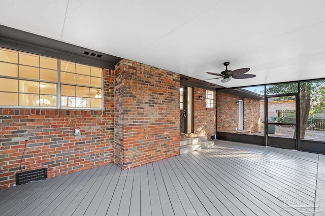 wooden terrace featuring ceiling fan