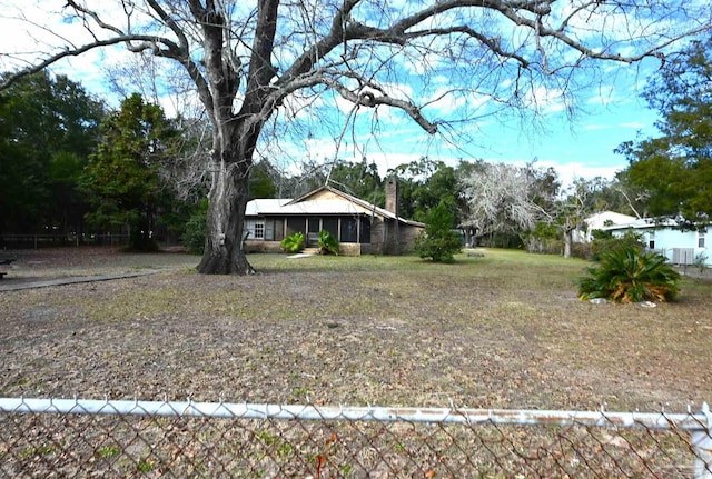 view of yard with a sunroom