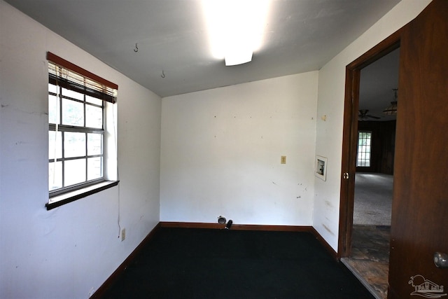 unfurnished room featuring carpet