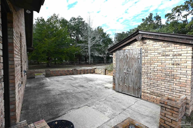 view of patio featuring a storage shed