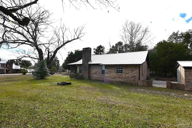 view of property exterior with a lawn