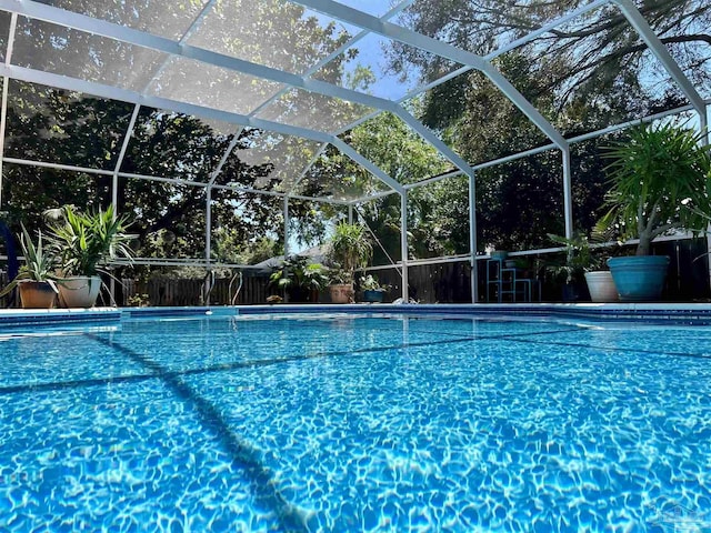 view of pool featuring a lanai