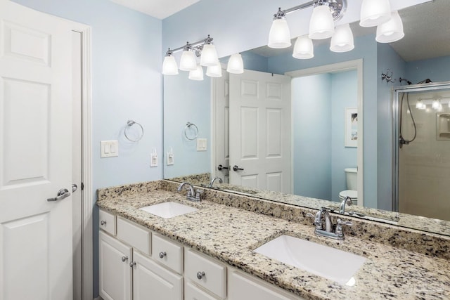 bathroom featuring walk in shower, vanity, and toilet