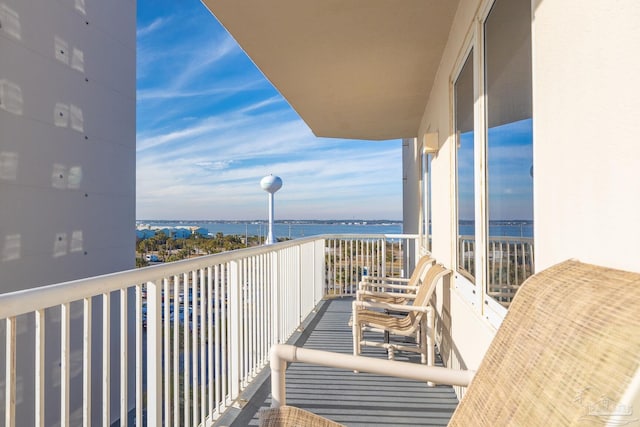 balcony featuring a water view