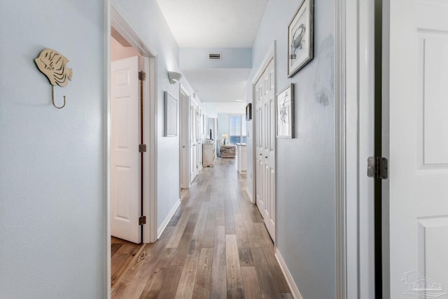 hall featuring light hardwood / wood-style flooring