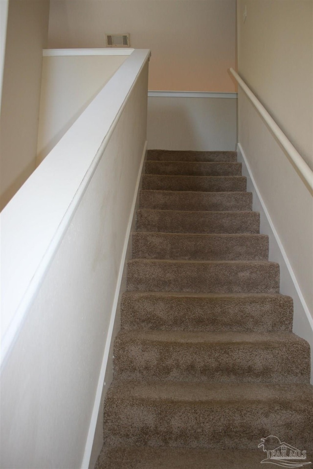 staircase featuring visible vents