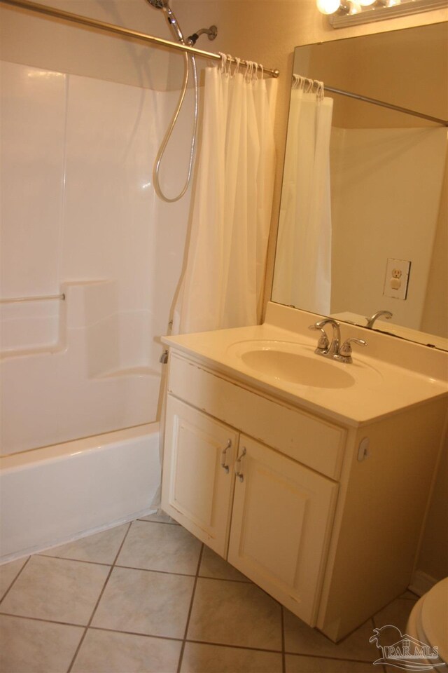 bathroom featuring shower / tub combo with curtain, vanity, and tile patterned floors