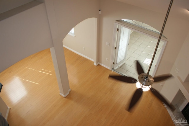 interior space with baseboards and wood finished floors