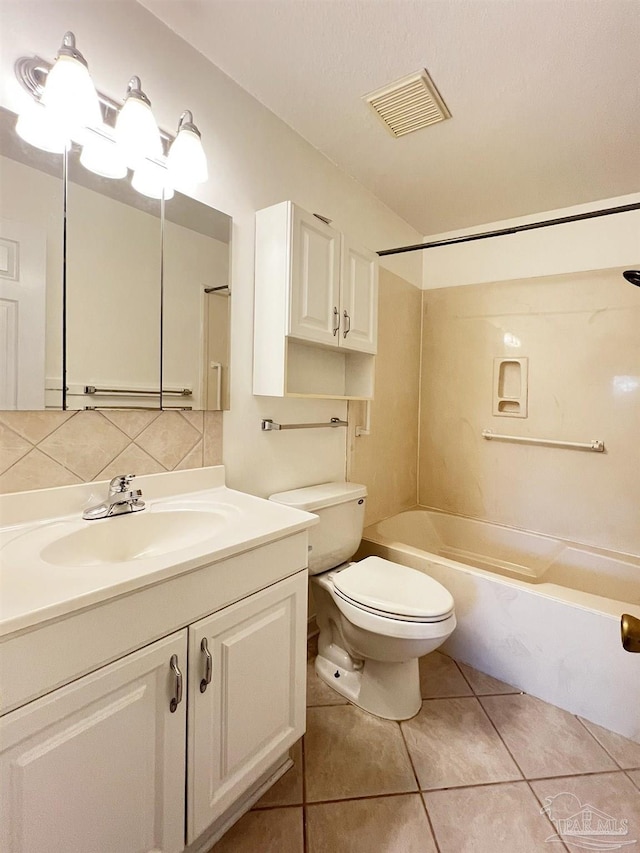 full bathroom with bathtub / shower combination, backsplash, vanity, toilet, and tile patterned floors