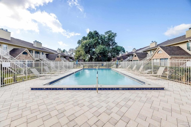 view of swimming pool featuring a patio