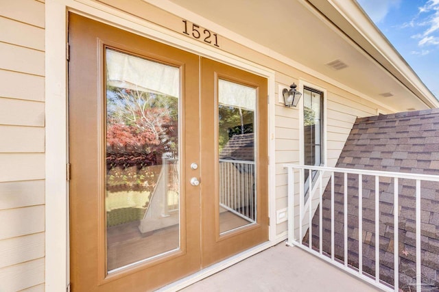 view of exterior entry featuring french doors