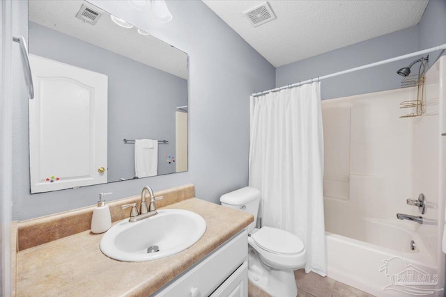 7951 Amethyst Dr, Pensacola, FL 32506 - bathroom featuring toilet, vanity, shower / tub combo with curtain, a textured ceiling, and tile patterned flooring