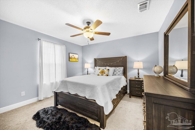 7951 Amethyst Dr, Pensacola, FL 32506 - bedroom featuring light colored carpet, baseboards, a ceiling fan, and a textured ceiling