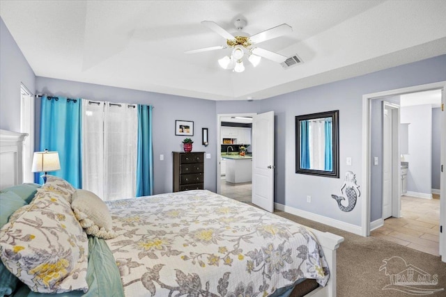 7951 Amethyst Dr, Pensacola, FL 32506 - carpeted bedroom featuring baseboards, a raised ceiling, ceiling fan, and a sink