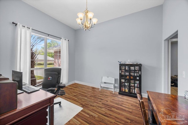 7951 Amethyst Dr, Pensacola, FL 32506 - office area with a chandelier, dark wood-type flooring, and baseboards