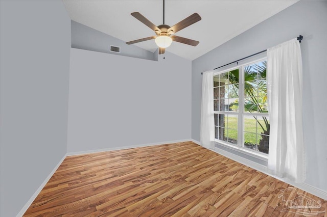 7951 Amethyst Dr, Pensacola, FL 32506 - unfurnished room with a ceiling fan, vaulted ceiling, wood finished floors, and baseboards