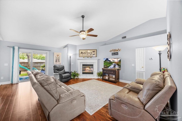 7951 Amethyst Dr, Pensacola, FL 32506 - living area with lofted ceiling, ceiling fan, wood finished floors, a tile fireplace, and baseboards