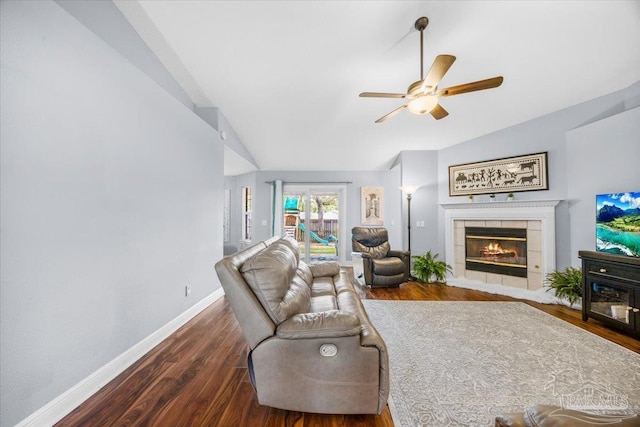 7951 Amethyst Dr, Pensacola, FL 32506 - living area featuring vaulted ceiling, baseboards, a ceiling fan, wood finished floors, and a tile fireplace