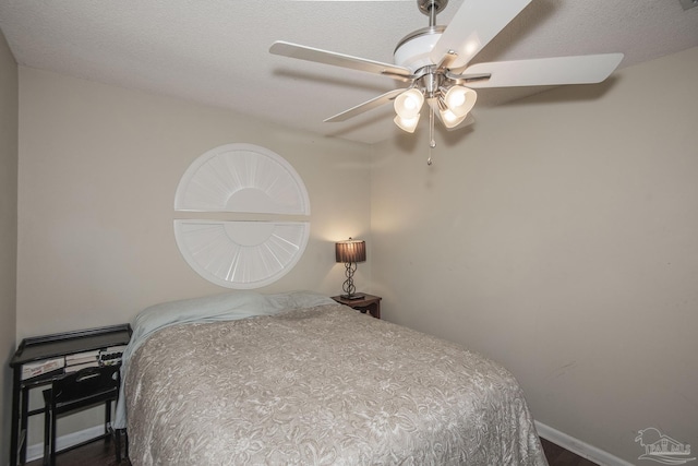 bedroom featuring a textured ceiling and ceiling fan