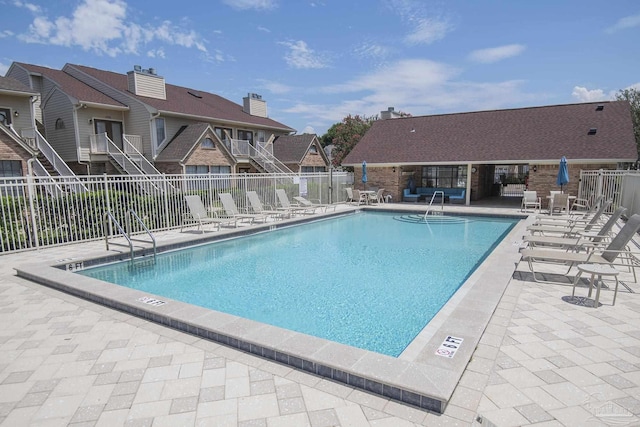 view of swimming pool featuring a patio