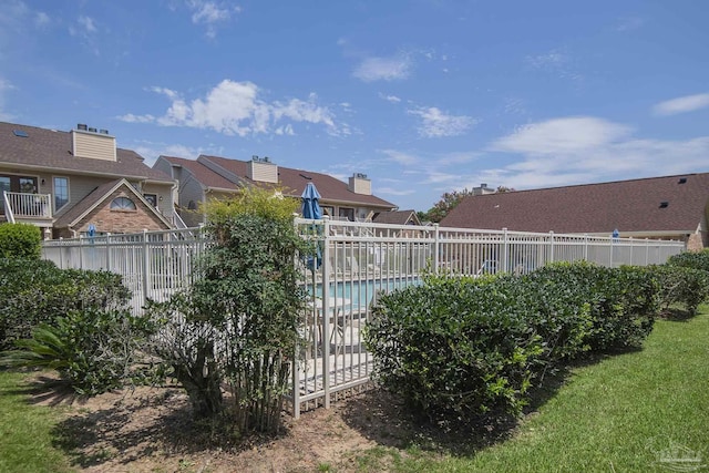 view of yard featuring a community pool