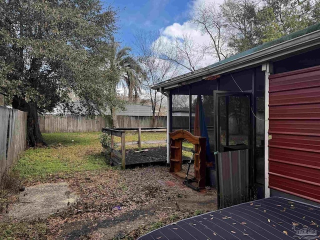 view of yard featuring a sunroom