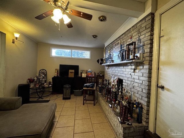 wine cellar with ceiling fan, ornamental molding, a textured ceiling, and light tile patterned floors