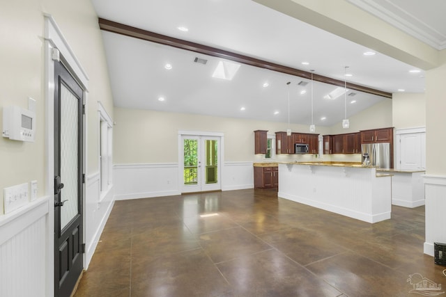 7515 Whiting Acres Ln, Milton, FL 32570 - unfurnished living room with french doors, beamed ceiling, high vaulted ceiling, wainscoting, and a decorative wall