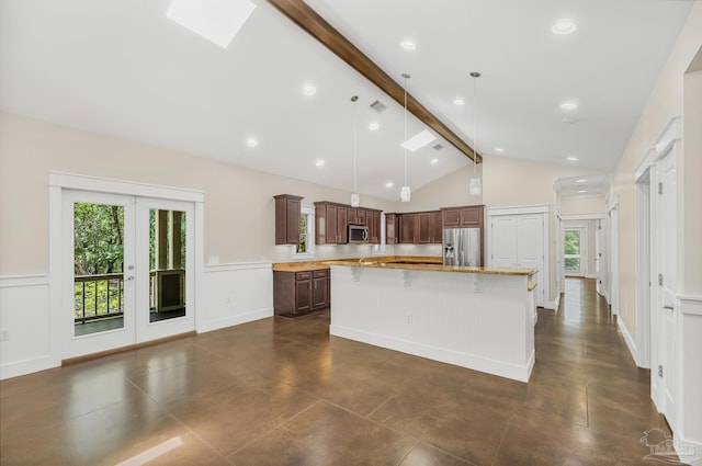7515 Whiting Acres Ln, Milton, FL 32570 - kitchen with stainless steel appliances, a center island with sink, a breakfast bar area, a skylight, and decorative light fixtures
