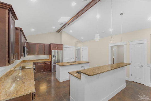 7515 Whiting Acres Ln, Milton, FL 32570 - kitchen with appliances with stainless steel finishes, an island with sink, beam ceiling, light stone counters, and hanging light fixtures