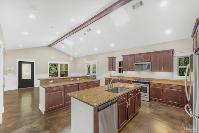 7515 Whiting Acres Ln, Milton, FL 32570 - kitchen featuring stainless steel appliances, a kitchen island with sink, hanging light fixtures, concrete flooring, and light stone counters