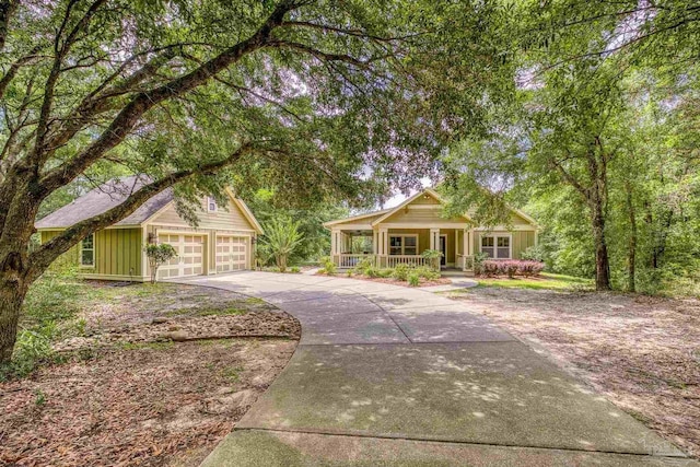 7515 Whiting Acres Ln, Milton, FL 32570 - view of front of house with a porch, driveway, and a garage