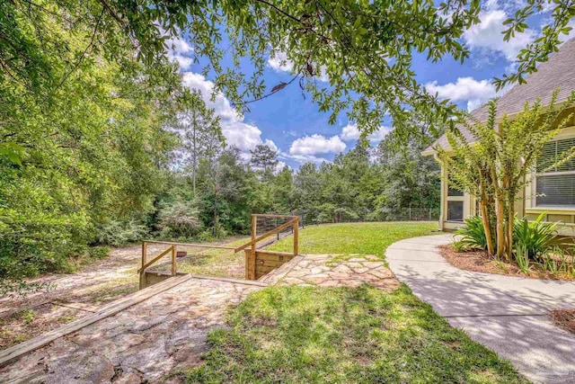 7515 Whiting Acres Ln, Milton, FL 32570 - view of green lawn featuring a vegetable garden