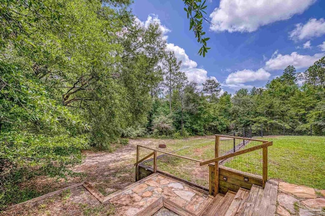 7515 Whiting Acres Ln, Milton, FL 32570 - wooden deck with a lawn and a view of trees