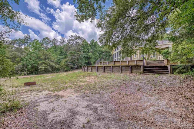 7515 Whiting Acres Ln, Milton, FL 32570 - view of yard with a deck and a view of trees