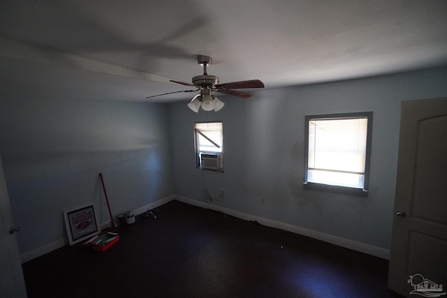 unfurnished room featuring ceiling fan and a wealth of natural light