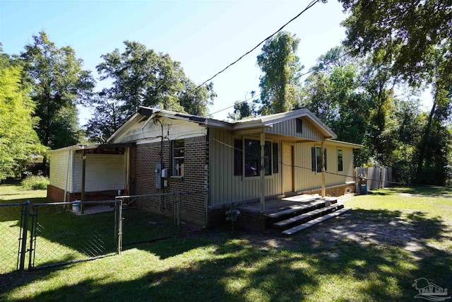 view of home's exterior featuring a yard